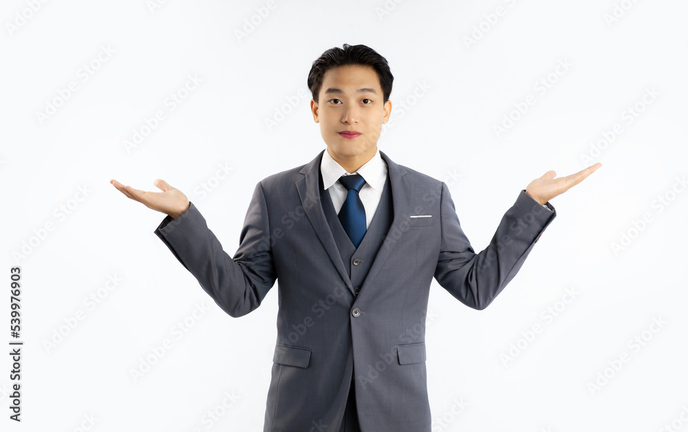 Asian businessman standing looking camera posed hands pointing for choose on white background.
Asian businessman standing looking camera posed hands pointing for choose on white background.