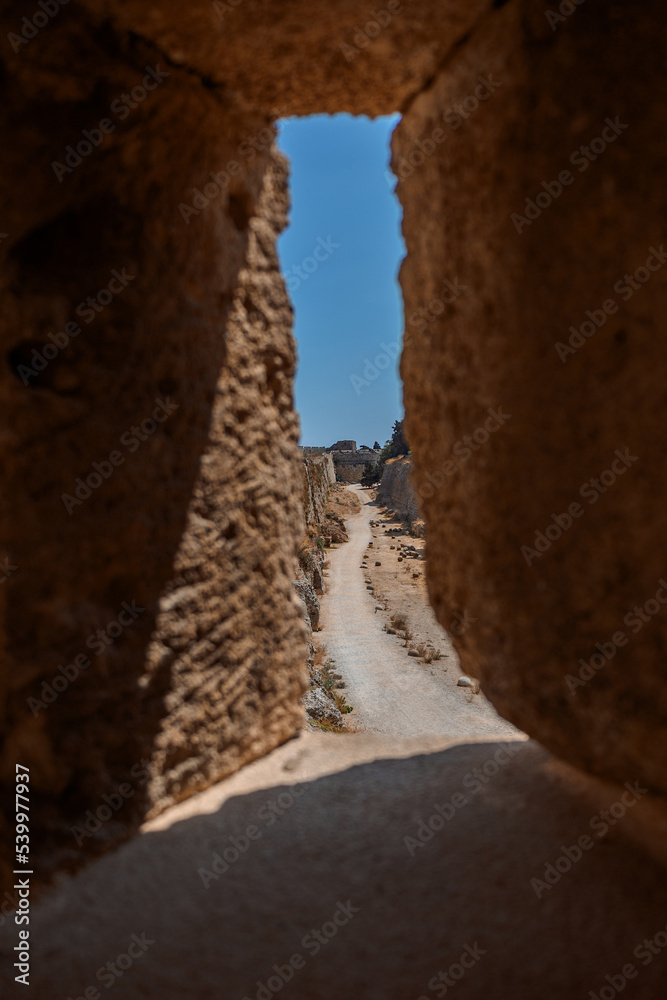 Stone powerful walls of old city, the ancient defense of Old Town, Rhodes, Dodecanese, Greece. High quality photo