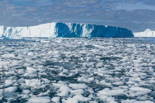 Huge icebergs from the Ilulissat Icefjord stranded on a former terminal moraine in Ilulissat, Greenland, Denmark, Polar Regions photo