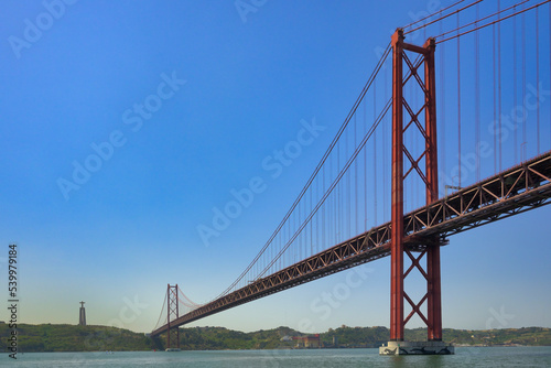 25 April suspension bridge over the Tagus River and Almada Christ, Lisbon photo