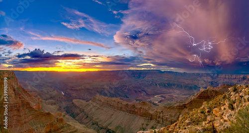 A dying storm at twilight viewed from Lipan Point, Grand Canyon, with Spider Lightning visible, Grand Canyon National Park, UNESCO World Heritage Site, Arizona photo