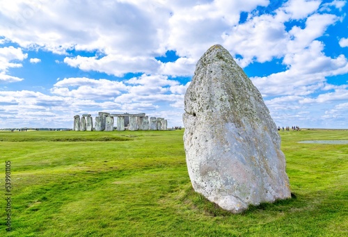 The Heel Stone and Stonehenge Prehistoric Monument, UNESCO World Heritage Site, near Amesbury, Wiltshire, England, United Kingdom photo
