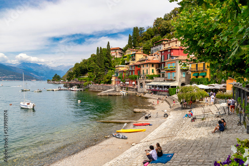 Tourists on the lakeside promenade, Varenna, Lake Como, Como, Lombardy, Italian Lakes, Italy photo