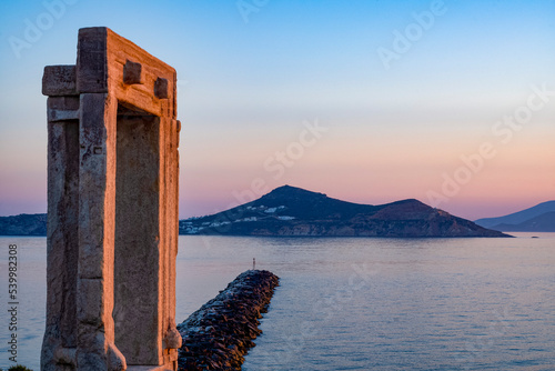 Dusk at Porta Gateway, part of the unfinished Temple of Apollo, Naxos Town, Naxos, the Cyclades, Aegean Sea, with Paros beyond, Greek Islands