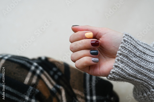Cozy nails design.Place for text. cozy autumn fall concept. Trendy manicure.
