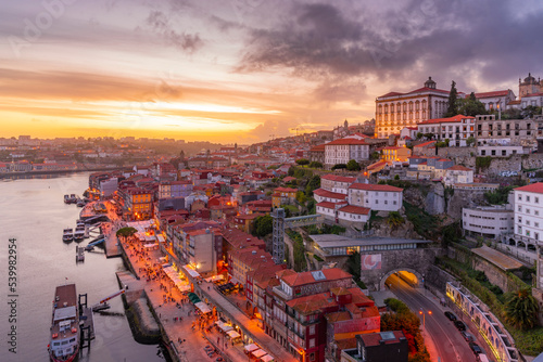 View of Douro River and The Ribeira district from Dom Luis I bridge at sunset, UNESCO World Heritage Site, Porto, Norte photo