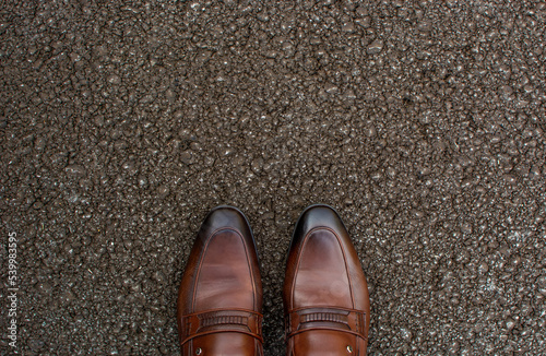 Top View of Business brown Shoes on the road with the space for text