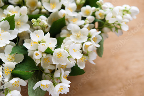 Beautiful flower arrangement. Jasmine flowers, free space for text on a light pastel background. Wedding, birthday. Valentine's day, mother's day. Top view, copy space
