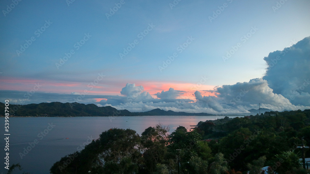 stunning tondano lake surrounded by beautiful hills