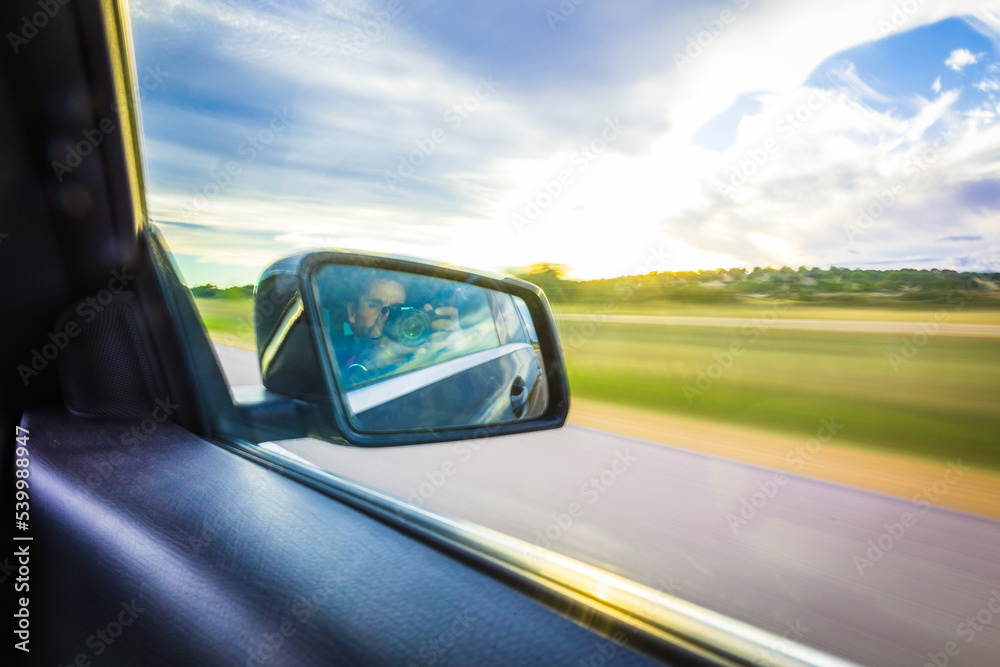 Driving fast on the highway. Highway background at sunset