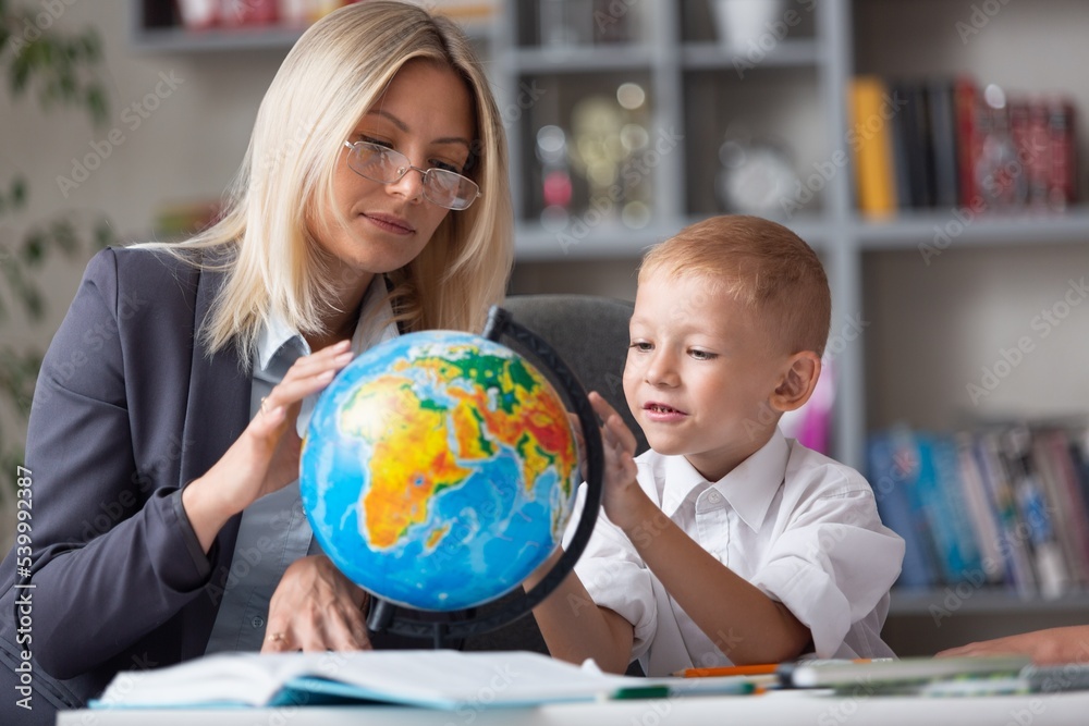 Teacher and children with globe, geography interesting learning. Teacher and children with globe, geography interesting learning.