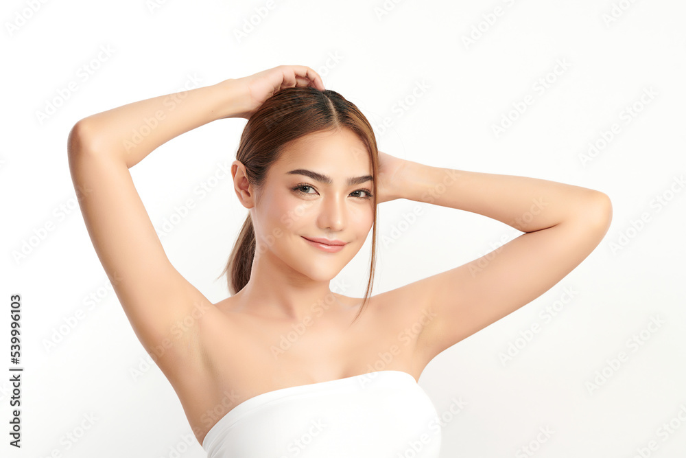 Beautiful Young Asian woman lifting hands up to show off clean and hygienic armpits or underarms on white background, Smooth armpit cleanliness and protection concept Beautiful Young Asian woman lifting hands up to show off clean and hygienic armpits or underarms on white background, Smooth armpit cleanliness and protection concept