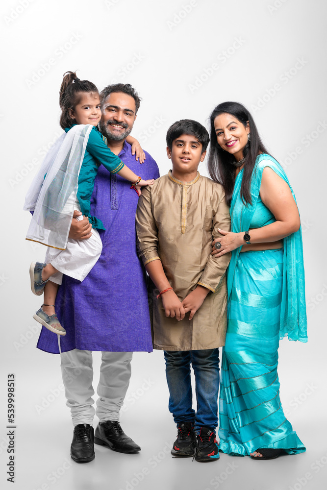 Happy indian family standing on white background. Stock Photo | Adobe Stock