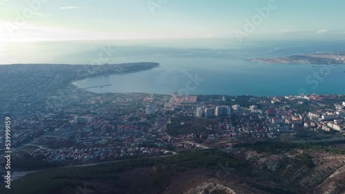 View of the city of Gelendzhik from a bird's eye view at sunset, flying from a drone