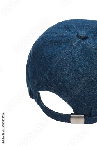 Close-up shot of a blue denim docker cap with a turn up brim. A men's ripped cap without a visor is isolated on a white background. Top view.