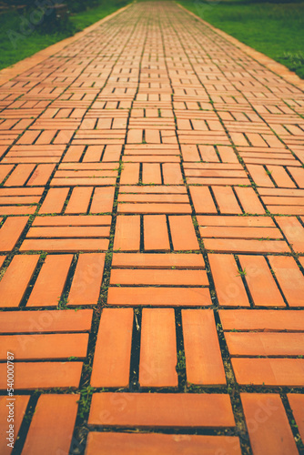 Selective focus shot of many bricks walkway.