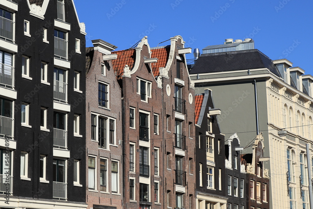Fototapeta premium Amsterdam Nieuwezijds Voorburgwal Street Historic House Facades with Various Gables View, Netherlands