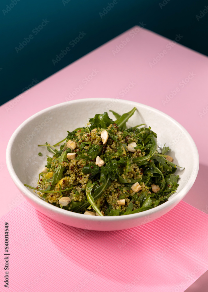 porridge with broccoli on a pink background porridge with broccoli on a pink background