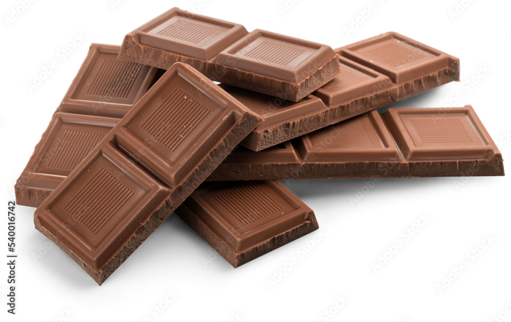 Pieces of delicious chocolate on white background