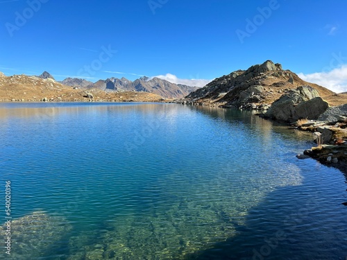 A crystal clear alpine lakes Laghi d Orsirora during a beautiful autumn day in the mountainous area of the St. Gotthard Pass  Gotthardpass   Airolo - Canton of Ticino  Tessin   Switzerland  Schweiz 