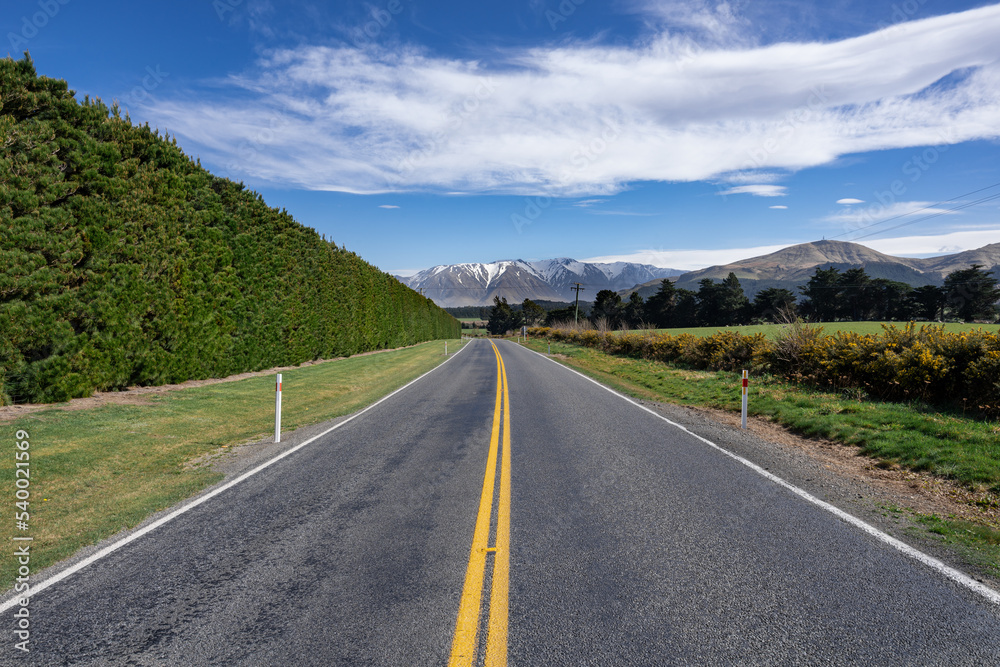 Landscape of Canterbury, South Island New Zealand, taken on the Inland Scenic Route 72, with wild bushes and snow-covered Alps in the background. Landscape of Canterbury, South Island New Zealand, taken on the Inland Scenic Route 72, with wild bushes and snow-covered Alps in the background.