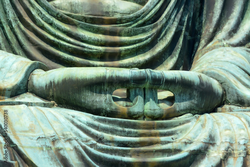 hands of the great buddha statue photo