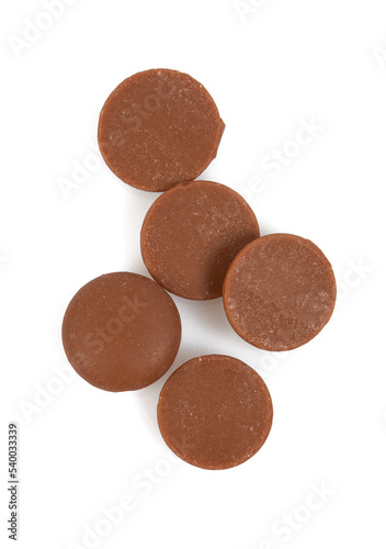 Tasty chocolate morsels isolated on white background.