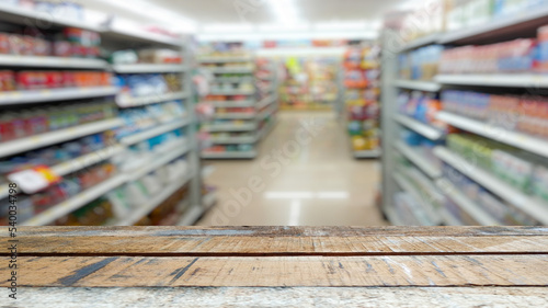 old brown wooden table supermarket shopping mall blur background