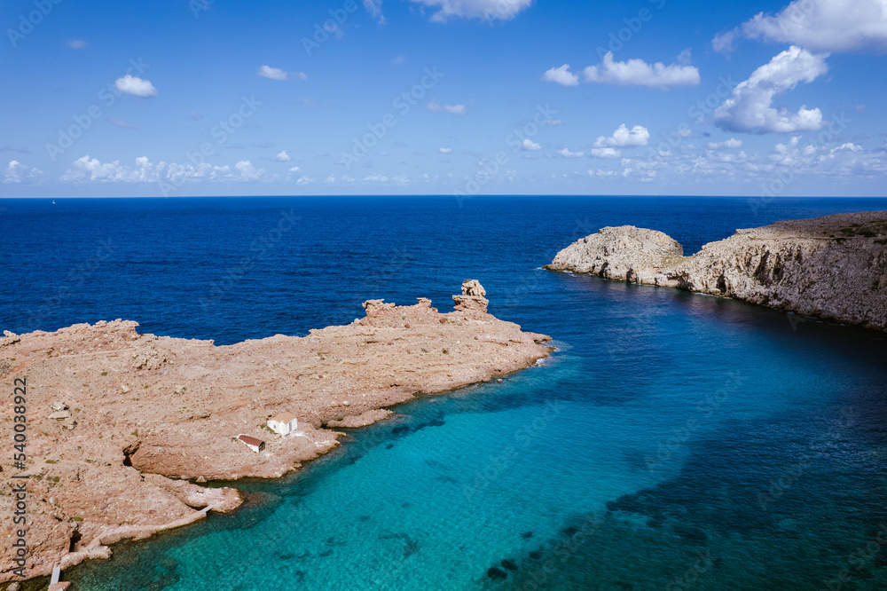 Dry rough rocks in blue ocean Dry rough rocks in blue ocean