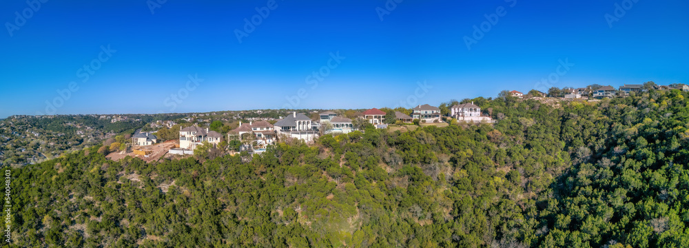 Austin, Texas- Mansions and villas on top of a mountain with trees on the slope