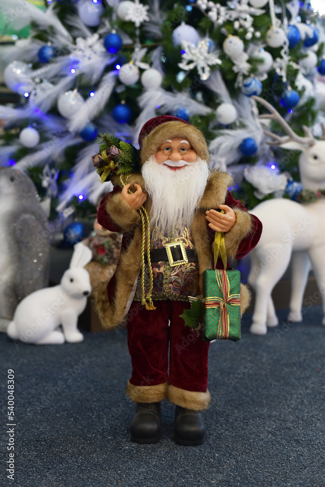 Santa Claus with gifts in the store