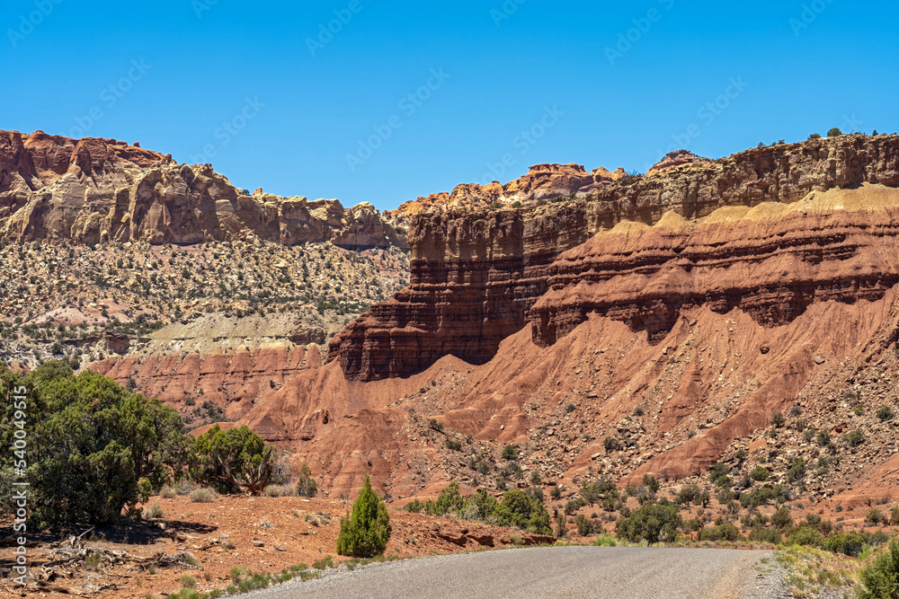 Burr Trail Road passes under Moenkopi and Chinle formations in the Grand Staircase-Escalante National Monument, Utah, USA Burr Trail Road passes under Moenkopi and Chinle formations in the Grand Staircase-Escalante National Monument, Utah, USA