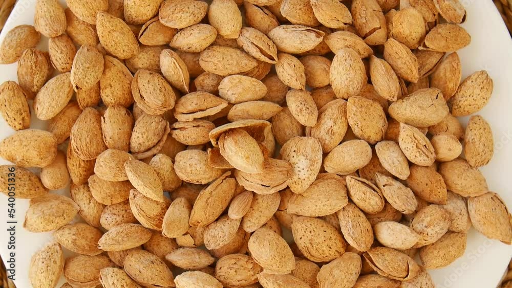 Roasted salted almonds on a plate. Roasted salted almonds on a plate.