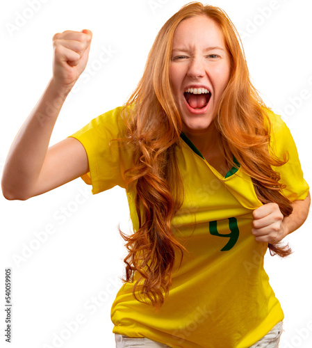 Brazil supporter. Brazilian redhead woman fan celebrating on soccer, football match on transparent background. Brazil colors. PNG photo