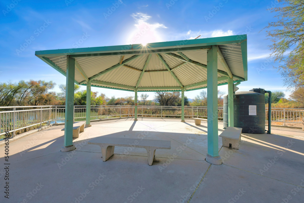 Benches under a pergola at Sweetwater Wetlands park with scenic nature views Benches under a pergola at Sweetwater Wetlands park with scenic nature views