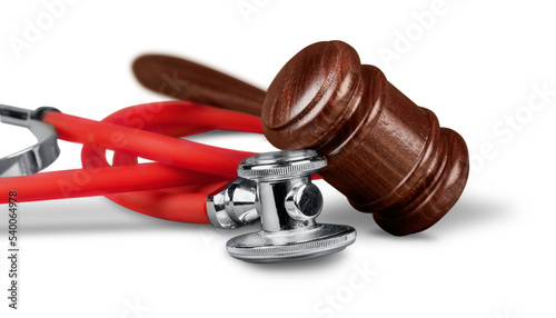 Gavel and stethoscope  on background, symbol photo for bungling and medical error photo