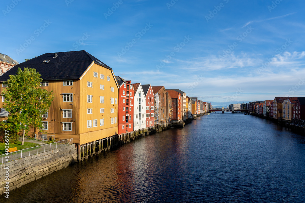 Trondheim, Norway - October 1, 2022: Waterfront colorful houses in Bakklandet, a neighborhood in the city of Trondheim, Norway. 