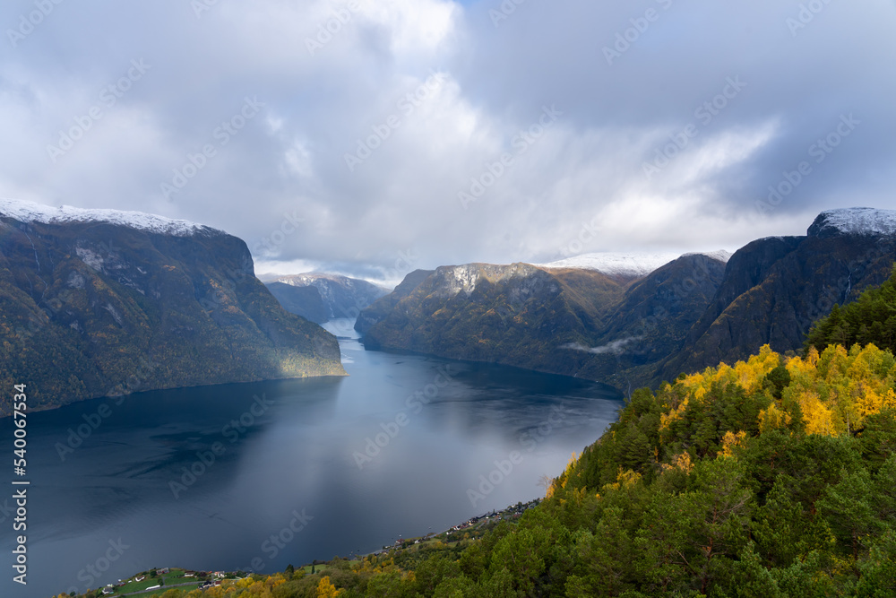 View of Aurlandsfjord and the surrounding snow mountains from the Stegastein viewing platform in fall. Aurlandsfjord is a fjord in Vestland county, Norway.