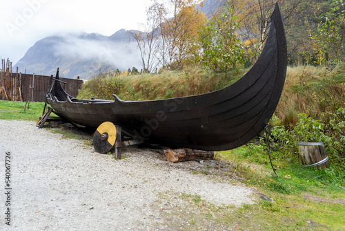 A Viking boat at Viking village in Gudvangen, Norway. The Valley is the setting for Njardarheimr town bringing to life the history and culture of the Viking age. photo