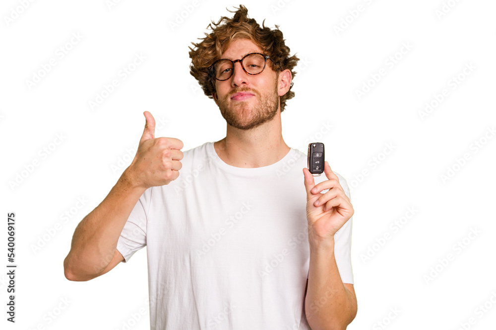 Young caucasian man holding car keys isolated on white background smiling and raising thumb up Young caucasian man holding car keys isolated on white background smiling and raising thumb up