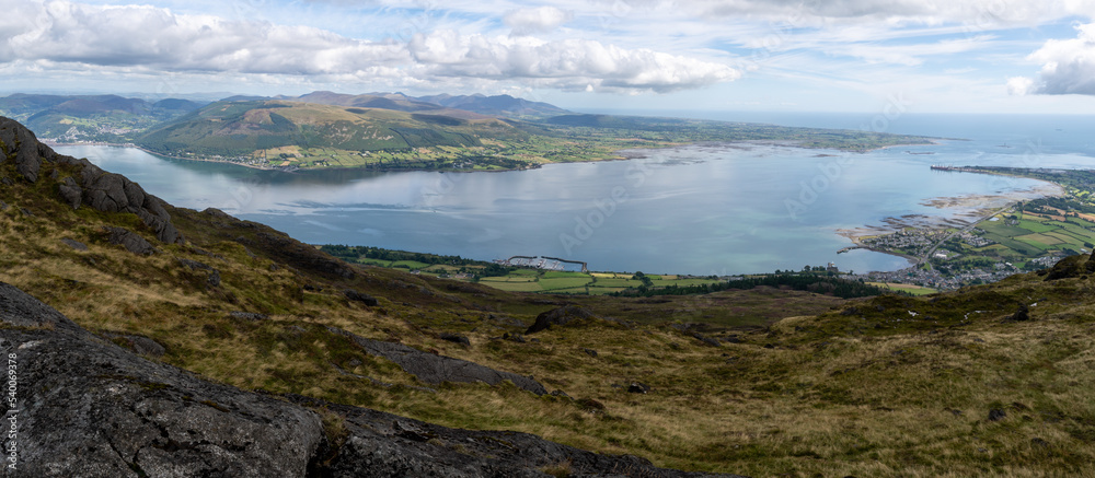View from Slieve Foy on fields and pastures with beautiful fiords in background. Ireland View from Slieve Foy on fields and pastures with beautiful fiords in background. Ireland