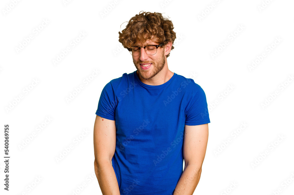 Obraz premium Young caucasian man isolated on green chroma background laughs and closes eyes, feels relaxed and happy.