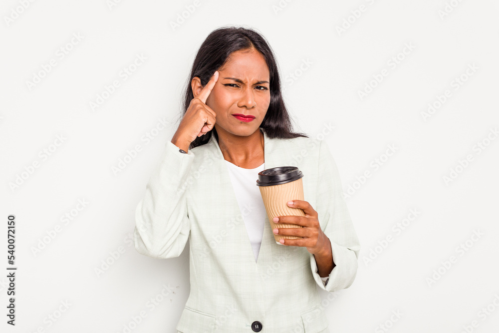 Young business Indian woman holding takeaway coffee isolated on white background showing a disappointment gesture with forefinger. Young business Indian woman holding takeaway coffee isolated on white background showing a disappointment gesture with forefinger.