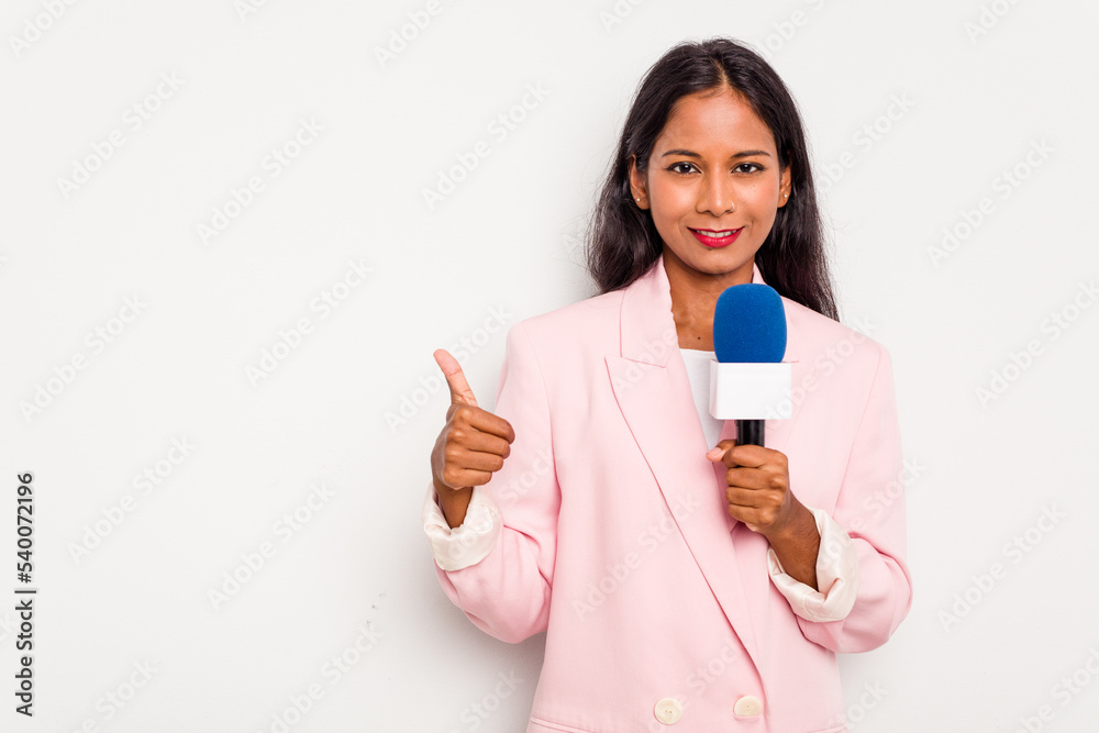 Young TV presenter indian woman isolated on white background smiling ...