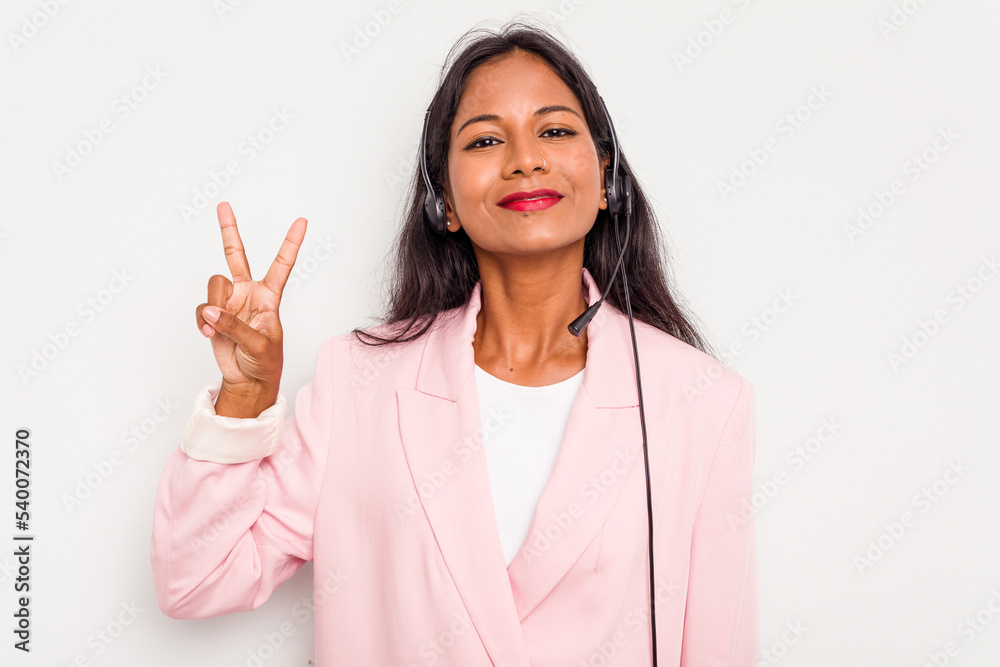 Telemarketer Indian woman working with a headset isolated on white background showing number two with fingers. Telemarketer Indian woman working with a headset isolated on white background showing number two with fingers.