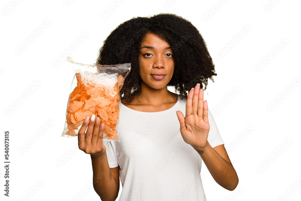 Young African american man holding crips isolated standing with