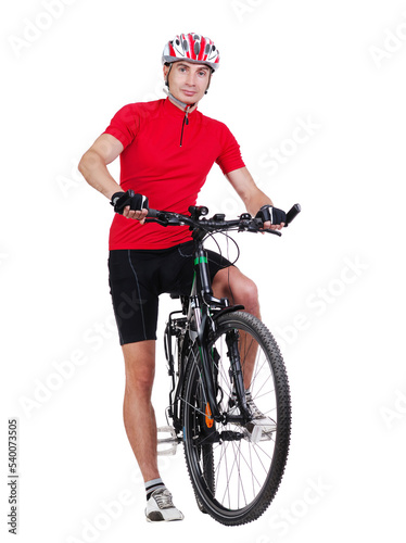 Standing cyclist holding his leg on a pedal