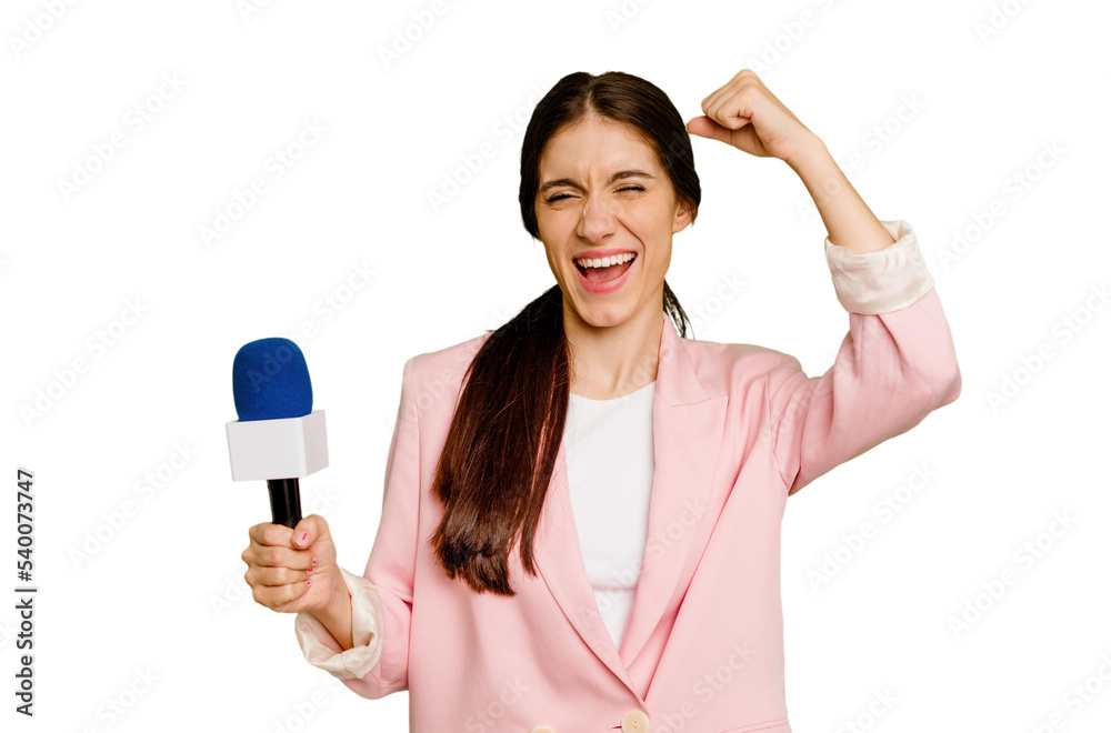 Young TV presenter caucasian woman isolated raising fist after a victory, winner concept. Young TV presenter caucasian woman isolated raising fist after a victory, winner concept.