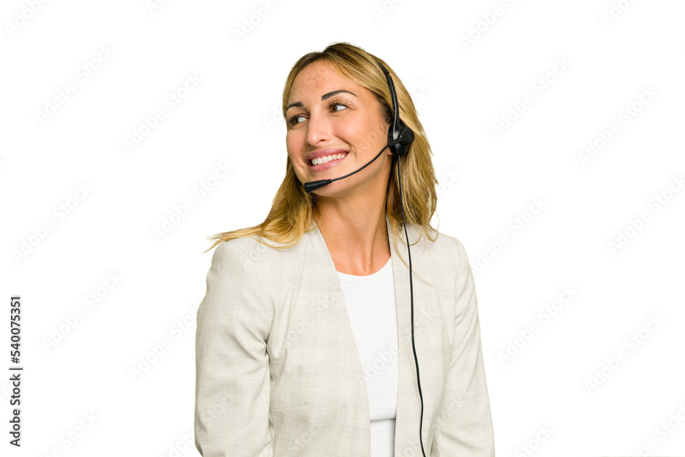 Telemarketer caucasian woman working with a headset isolated on green chroma background looks aside smiling, cheerful and pleasant. Telemarketer caucasian woman working with a headset isolated on green chroma background looks aside smiling, cheerful and pleasant.