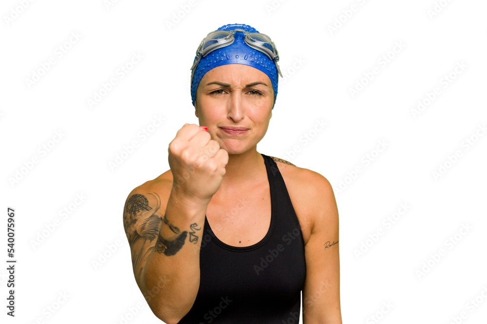 Young caucasian swimmer woman isolated on green chroma background showing fist to camera, aggressive facial expression. Young caucasian swimmer woman isolated on green chroma background showing fist to camera, aggressive facial expression.
